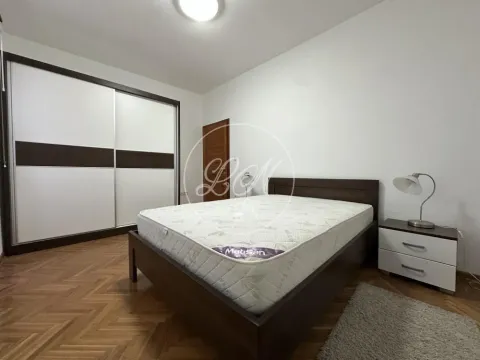 Bedroom with a double bed, large wardrobe and bedside table. - image 10