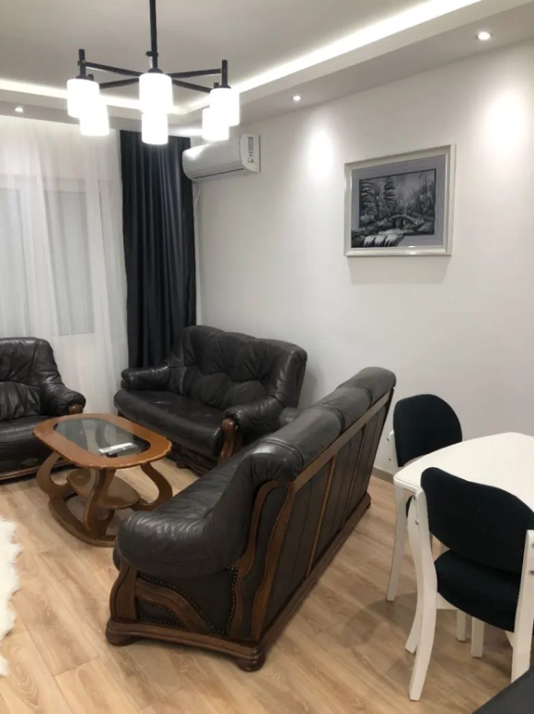 Living room with furniture and a dining table.