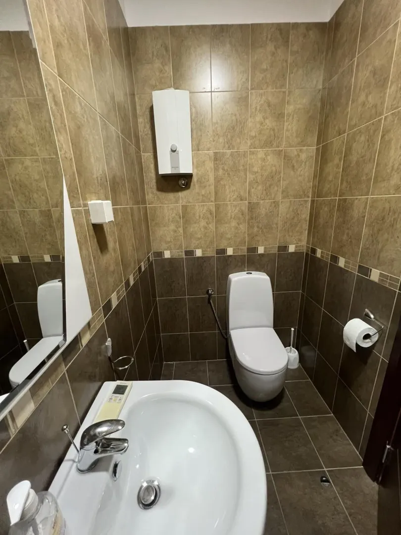 Simple bathroom with a toilet and sink.