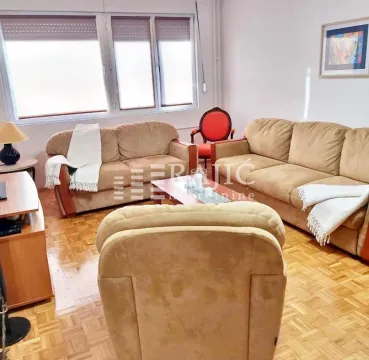Living room with a seating set and parquet flooring. - image 2