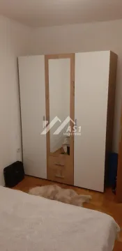 Bedroom with a large wardrobe and bed. - image 5