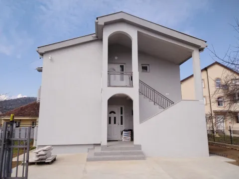 Modern two-story house with a light facade and outdoor stairs. - image 3