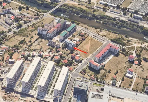 Satellite view of the wider location with the marked building and surrounding neighborhoods. - image 7