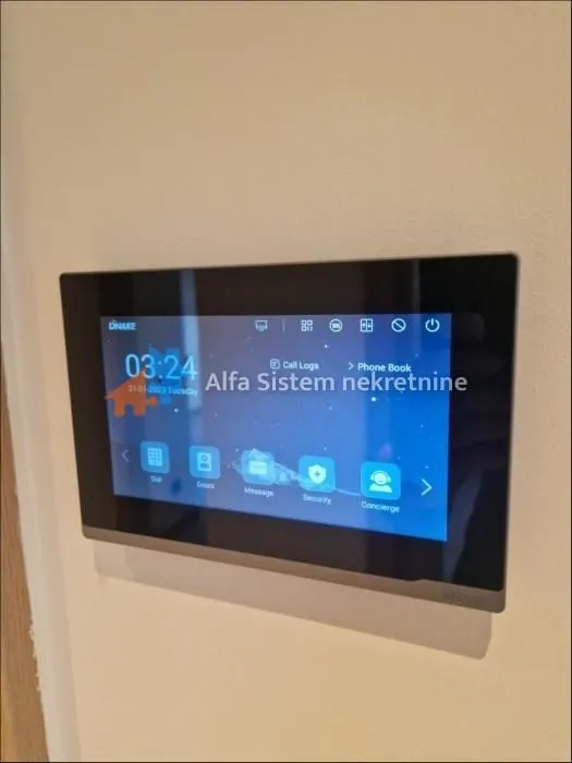Intercom screen mounted on the wall.