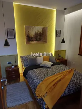 Modern bedroom with a double bed, decorative lighting and bedside tables. - image 10