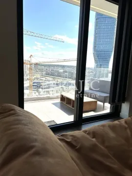 View from the terrace towards the city and construction site. - image 9