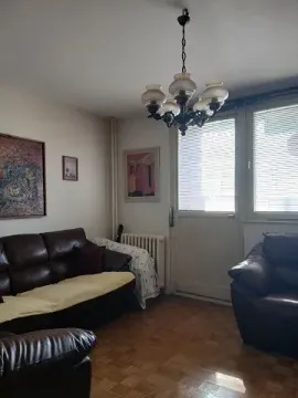 Living room with leather sofas, parquet flooring, and access to the terrace. - image 10