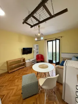 Living room with a dining table and access to the terrace. - image 4