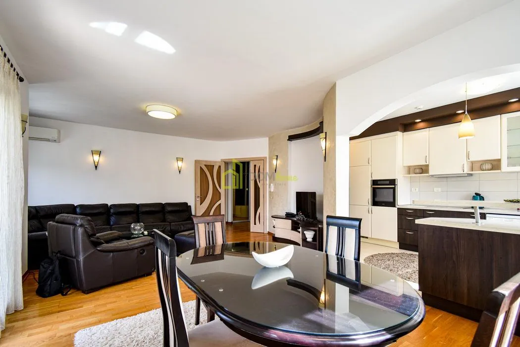 Spacious living room connected to the dining area and kitchen.