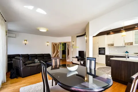 Spacious living room connected to the dining area and kitchen. - image 10