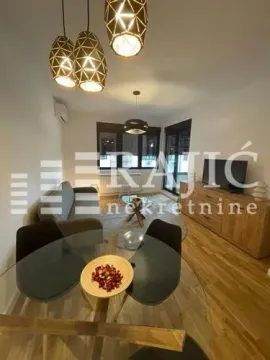 Modern living room with a dining area and built-in lighting. - image 7