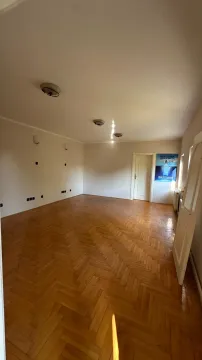 Empty room with parquet flooring and white walls. - image 10