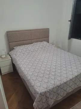 Furnished bedroom with a double bed and bedside tables. - image 6