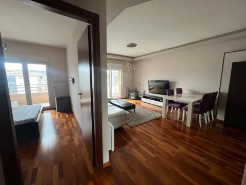 Spacious living room with dining area and access to the terrace. - image 10