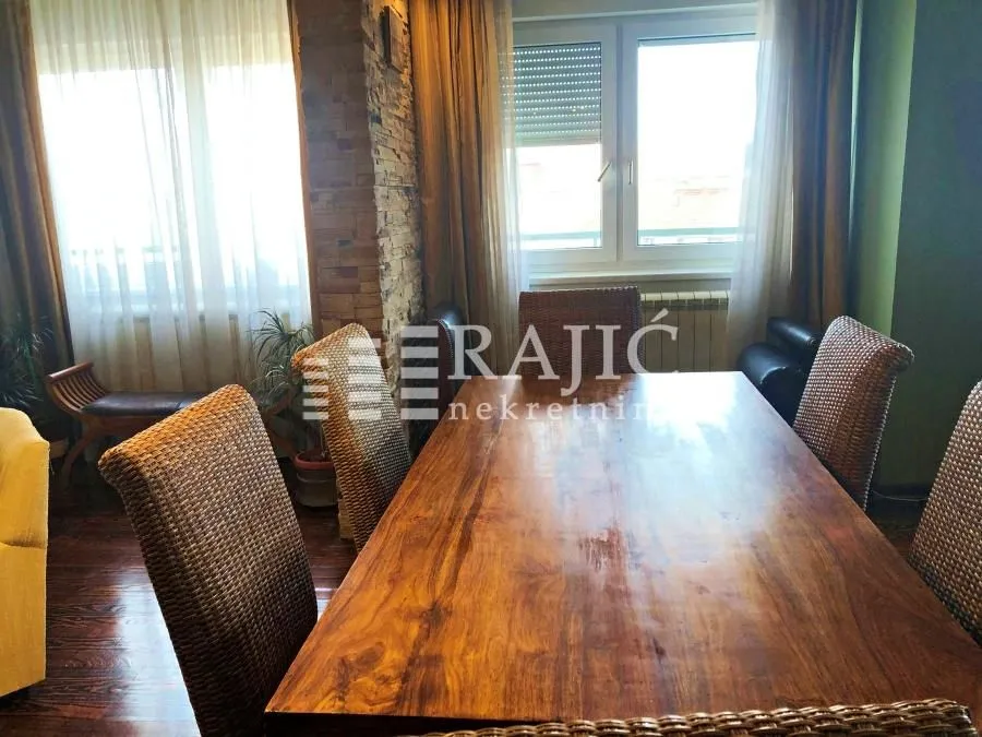 Dining room with a wooden table and chairs.