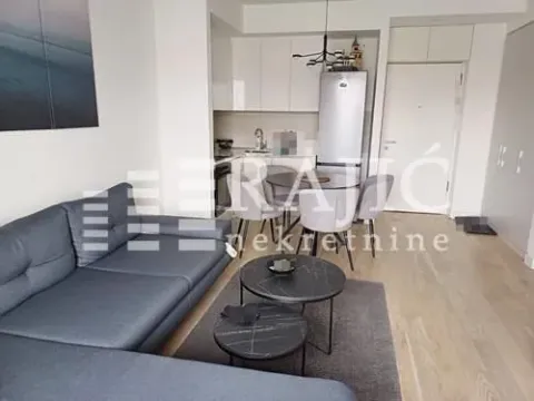 Living room connected to the dining area and kitchen. - image 3