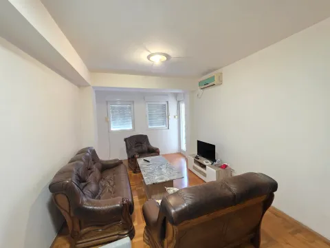 Living room furnished with leather suites and a TV. - image 3