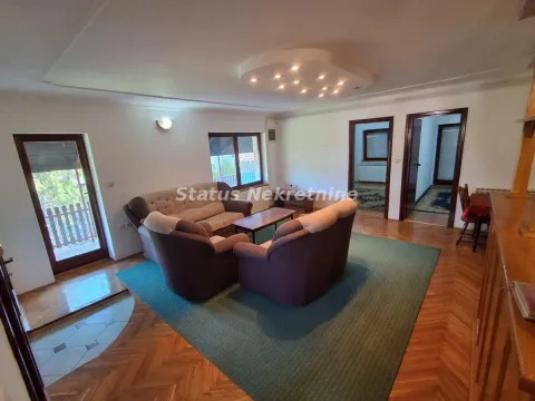 Spacious living room with seating furniture and parquet flooring. - image 5