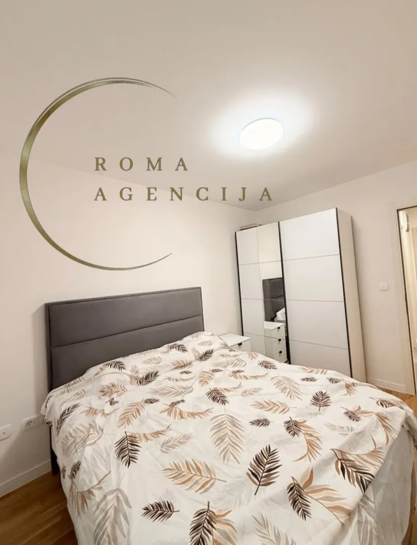 Bedroom with a double bed and a wardrobe.