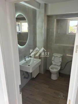 Modern equipped bathroom with a washbasin and toilet. - image 10