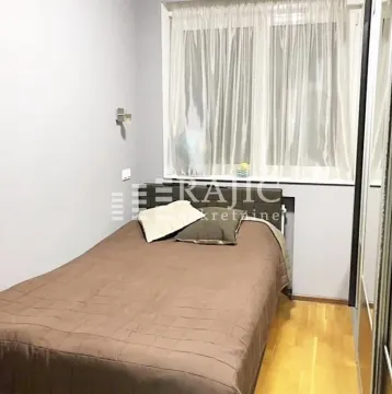 Smaller bedroom with a double bed and a window. - image 9