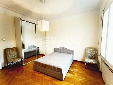 Bedroom with a double bed, mirrored wardrobe, and parquet flooring. - image 9