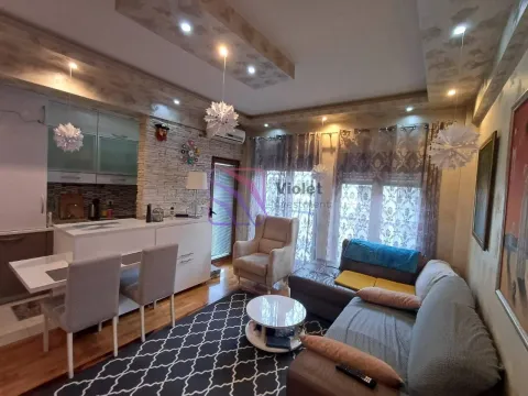 Living room with a sofa set and dining area in an open-plan layout. - image 3