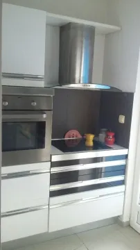 Kitchen elements with a built-in oven and stovetop. - image 3