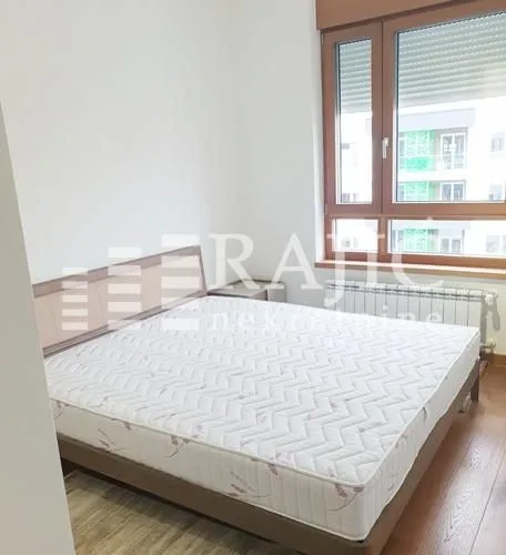 Bedroom with a double bed and a window.