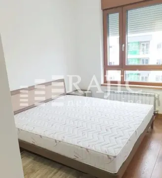 Bedroom with a double bed and a window. - image 11