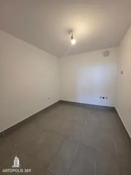 Empty room with floor tiles and white walls. - image 10