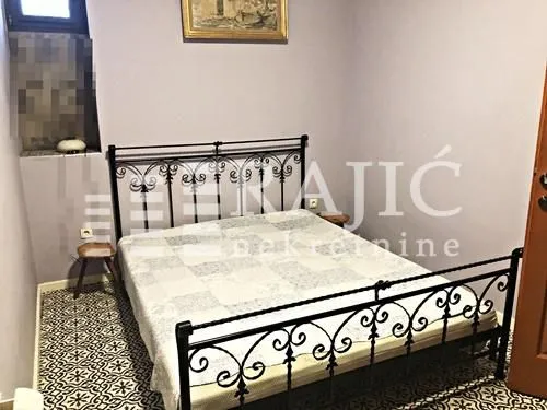 Bedroom with a wrought iron bed.