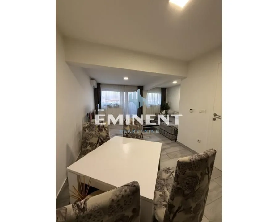Living room with dining table and chairs.
