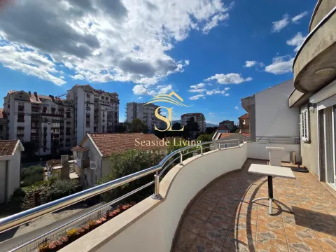 Spacious balcony with a view of the city and surrounding buildings. - image 15
