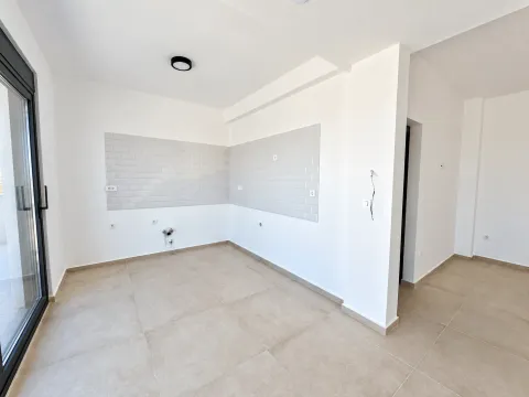 Unfurnished space with prepared wall tiles for kitchen installation. - image 8