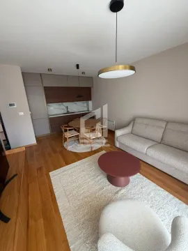 Living room with kitchen and dining area in a modern apartment. - image 5