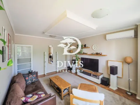 Living room with sofa, TV and wooden coffee table. - image 5
