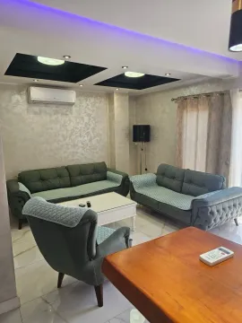 Living room with a sofa set and a dining table. - image 6