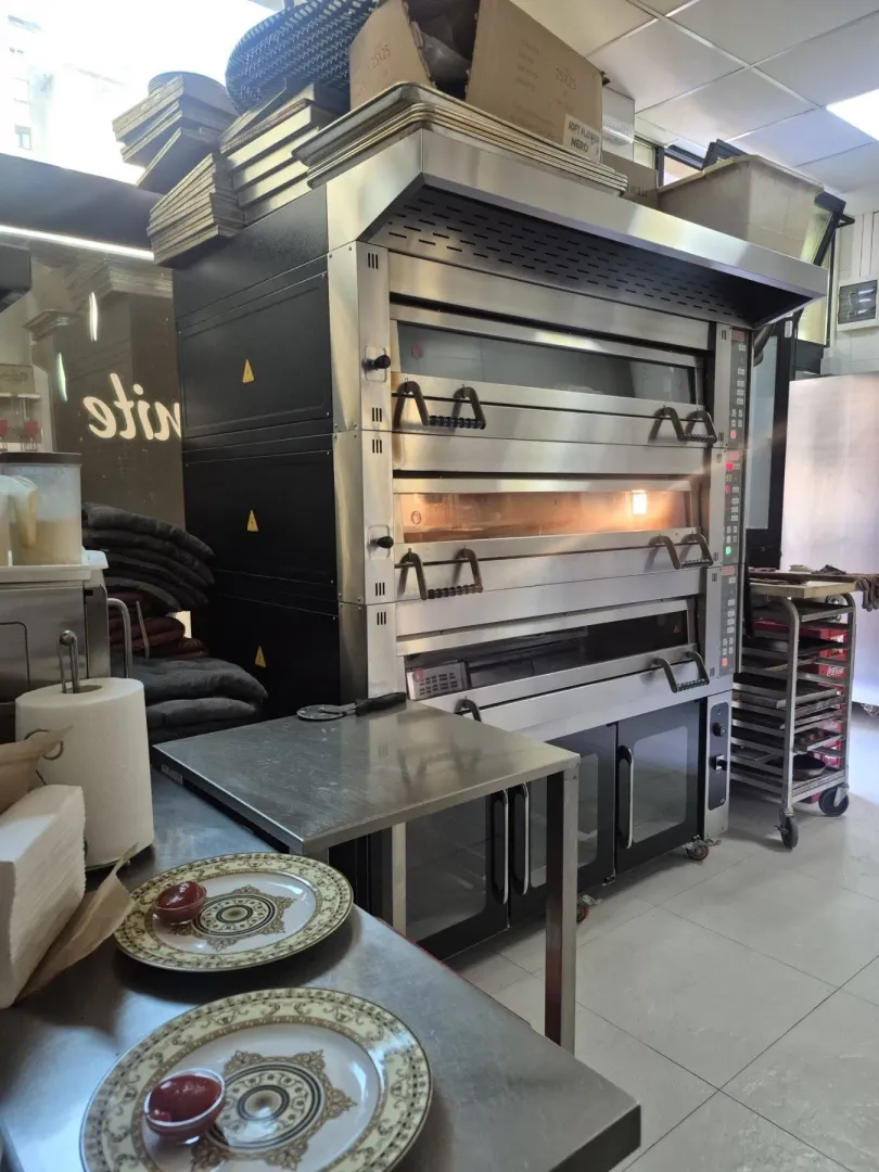 Professional oven in a spacious kitchen of a commercial property.