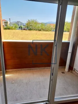 View from the balcony overlooking the surrounding neighborhood and nature. - image 6