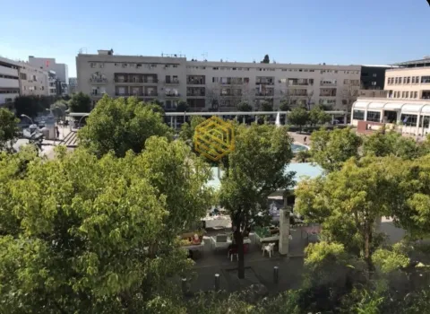 View from the terrace overlooking the city square and surrounding buildings. - image 3