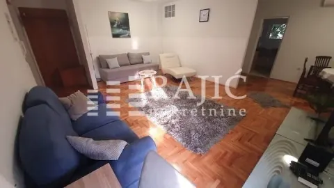 Living room with sofa set and parquet flooring. - image 14
