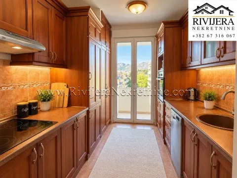 Kitchen with wooden cabinetry and access to the terrace. - image 7