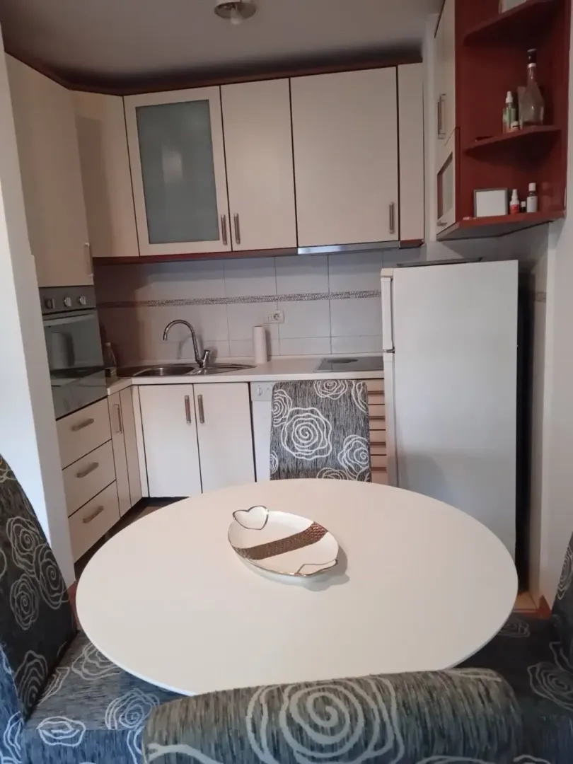 Smaller kitchen with a dining table and built-in appliances.