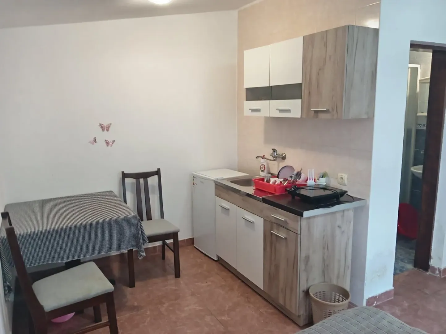 Small kitchen with a dining table and chairs.