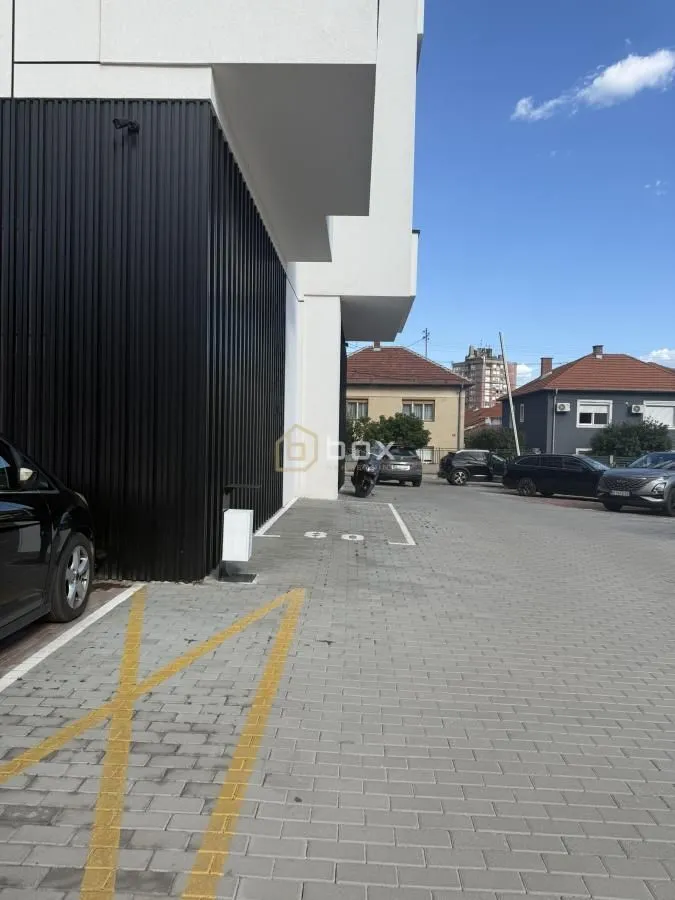 View of the exterior of the building and parking area.