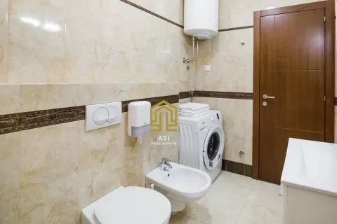 Equipped bathroom with sanitary ware, washing machine, and ceramic tiles. - image 9
