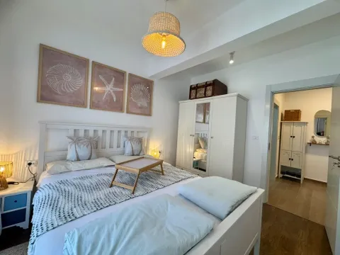 Bright and tidy bedroom with a double bed and wardrobe. - image 18