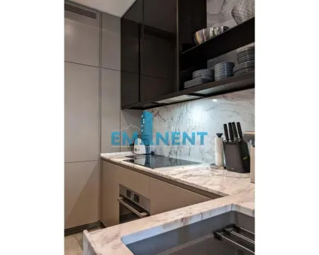 Modern kitchen with marble countertops and built-in appliances. - image 4