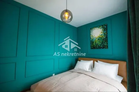 Bedroom with a double bed and decorative wall moldings. - image 7